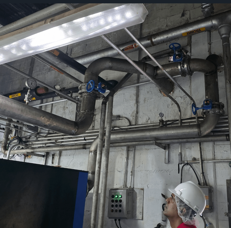 Engineer Inspecting Factory Piping System